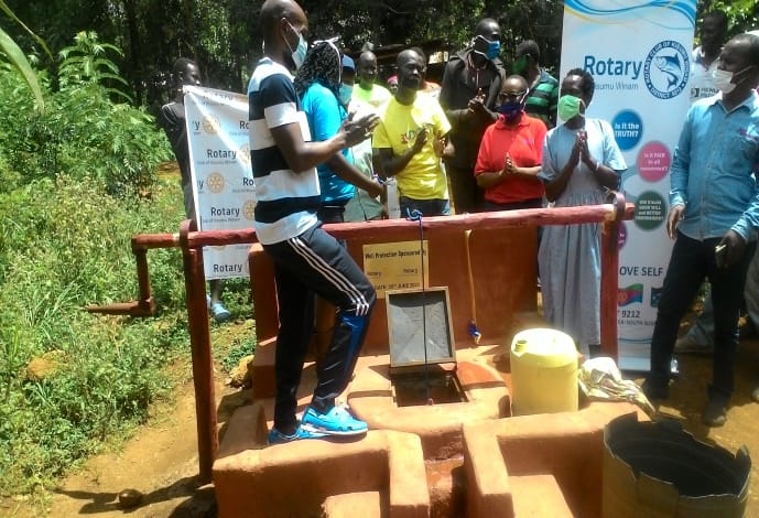Community gathering at a well commissioning